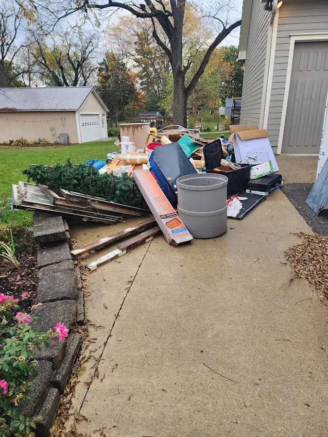 Dumpster being loaded with debris for Residential Dumpster Rental in Montague